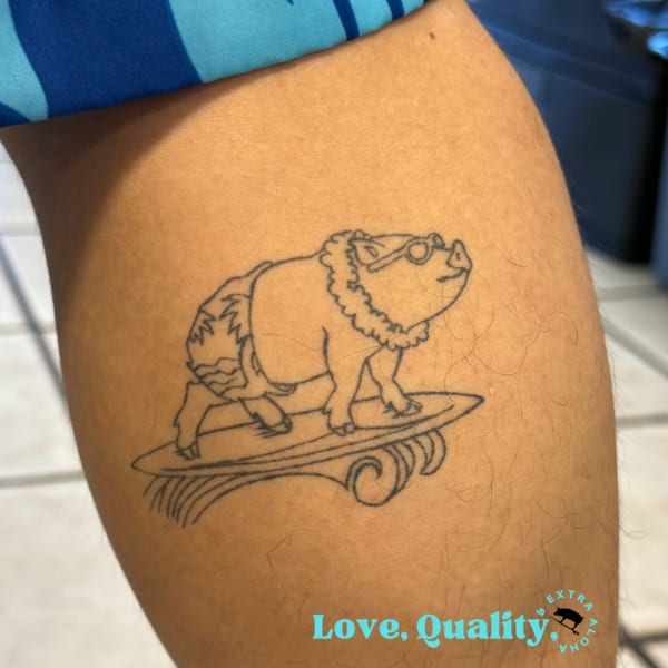 A Kono's Hawaiian restaurant tattoo of a surfing pig wearing sunglasses and a lei on a person's arm.